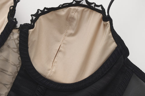 KissKismet black satin longline bustier lingerie set featuring vintage romantic rose embroidery, a seductive lace-up front corset detail, and a matching sheer mesh panty. Perfect for dark coquette aesthetic and lingerie as outerwear.