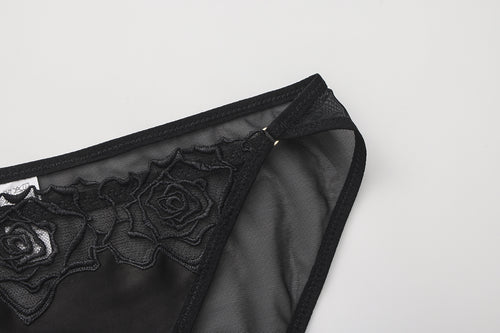 KissKismet black satin corset lingerie set. Features a lace-up longline bustier with French rose embroidery and a matching sheer mesh panty, perfect for dark romance styling or lingerie-as-outerwear looks.
