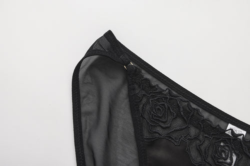 KissKismet black satin corset lingerie set. Features a lace-up longline bustier with French rose embroidery and a matching sheer mesh panty, perfect for dark romance styling or lingerie-as-outerwear looks.
