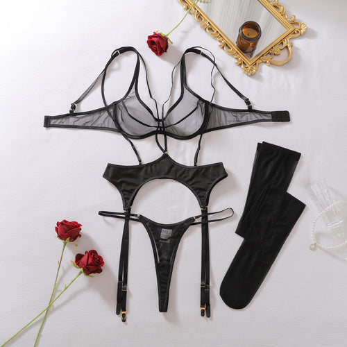 Close-up flat lay focusing on the sheer mesh cups and the crossed halter-neck straps of the black underwire bra.