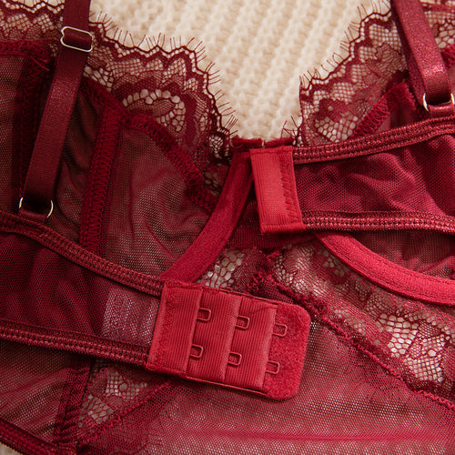 Extreme close-up flat lay detailing the multi-row hook-and-eye back closure and sheer mesh fabric.
