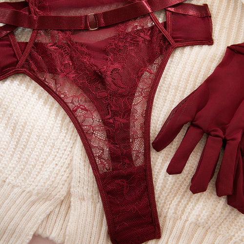 Detailed flat lay of the high-cut leg opening and the delicate scalloped lace edge of the bodysuit's bottom.