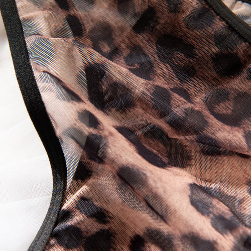 Close-up macro flat lay showcasing the fine, breathable texture of the sheer leopard print mesh fabric.