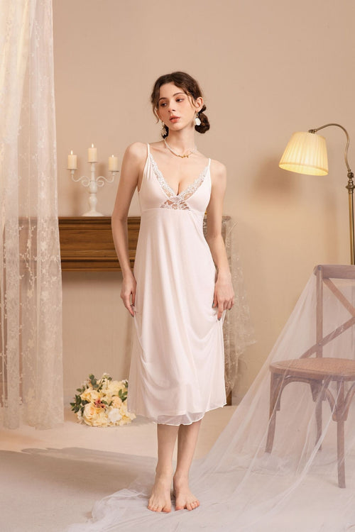 Full-length shot of a model in a soft modal sleep dress, emphasizing the flowing lace-trimmed hemline.