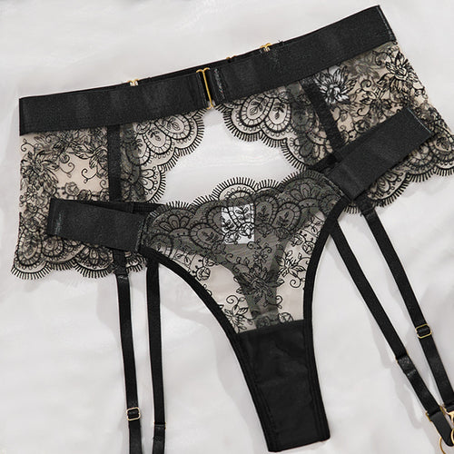 KissKismet black scalloped lace lingerie set featuring an underwire bra with strappy back details, high-waisted garter belt, and adjustable leg rings with gold-tone hardware.