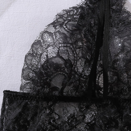 Detailed view of delicate floral eyelash lace fabric