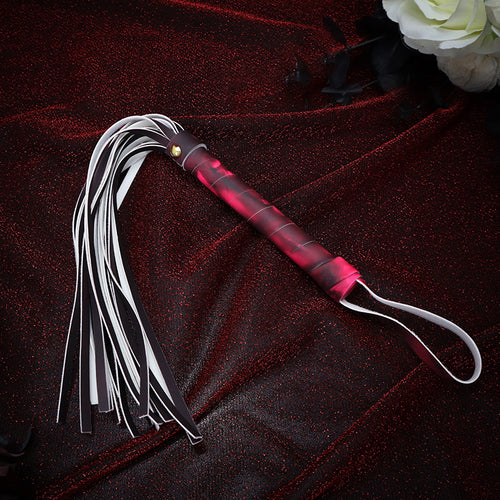 Dynamic shot of color-changing leather fringe whip