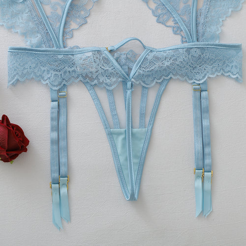 Close-up flat lay of the back view of the light blue garter belt and thong.