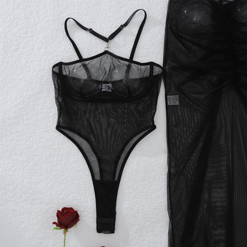 Close-up flat lay view of the KissKismet black sheer mesh bodysuit, focusing on the daring plunging neckline and center O-ring.