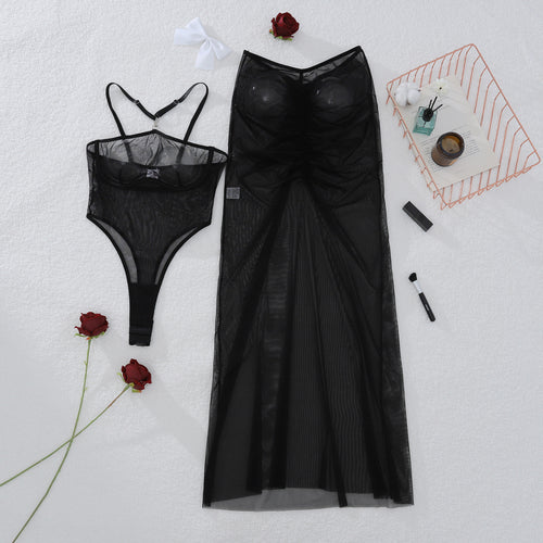 Flat lay presentation of the complete KissKismet 2-piece set, including the plunging halter bodysuit and sheer ruched maxi skirt.