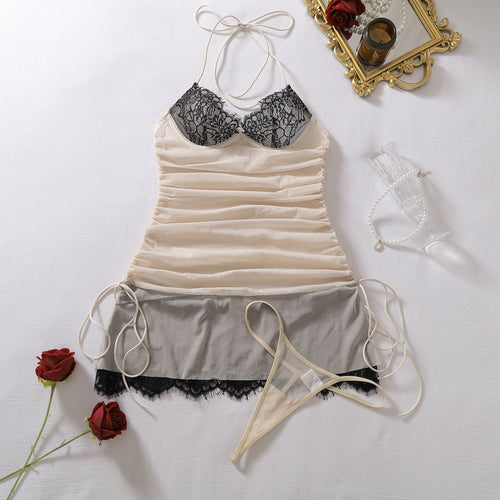 Flat lay front view of the Champagne Noir sheer ruched slip and matching string thong set.