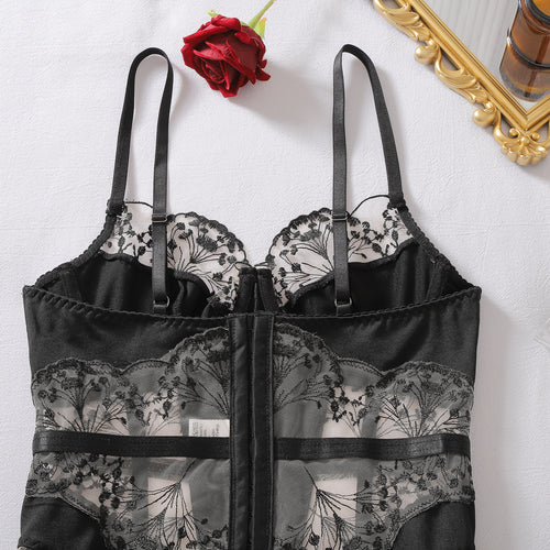 Close-up flat lay showing the adjustable multi-row hook-and-eye back closure of the corset.