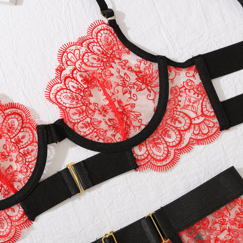 Detailed close-up of the underwire and gleaming gold-tone hardware on the KissKismet crimson and black structured lace demi bra.
