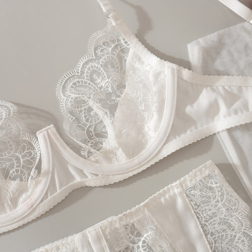 Detailed flat lay showcasing the romantic eyelash fringe trim on the KissKismet ivory innocence bridal lingerie set.