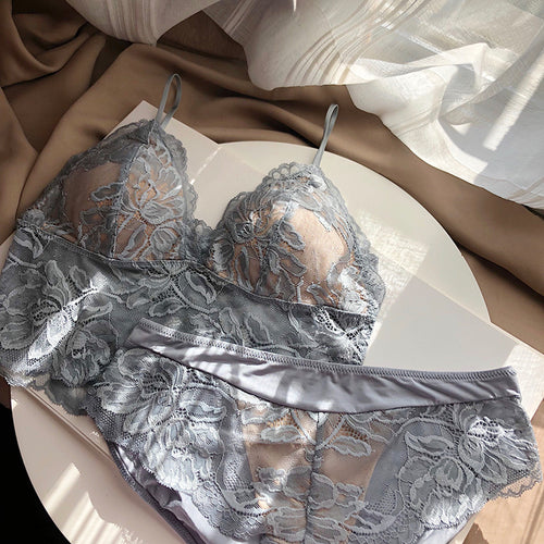 Flat lay presentation of the complete KissKismet dusty blue 2-piece set, beautifully capturing the wireless lace bralette and matching panty.