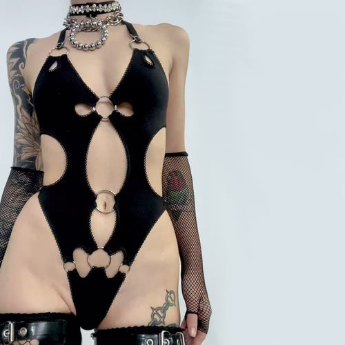 Moody artistic shot of black cutout halter bodysuit