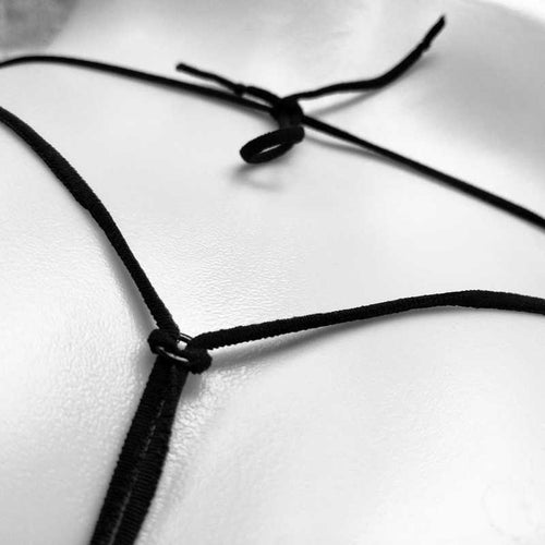 Close-up detail of the back string and knots on a minimal G-string