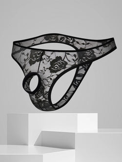 Floating display of sheer black lace men's thong featuring floral embroidery and a front opening