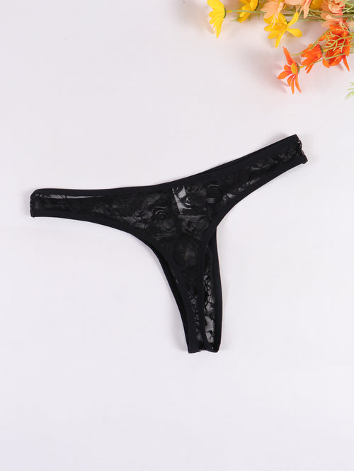 Flat lay view of the back of a black sheer lace men's T-back thong