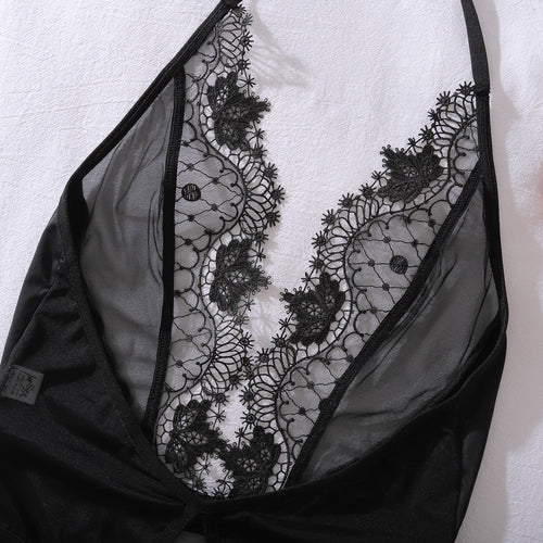 Aesthetic flat lay shot of the Ethereal Noir embroidered bodysuit, highlighting the intricate lace patterns and premium craftsmanship.
