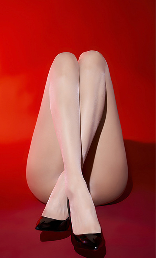 Aesthetic shot of the pearl white sheer tights, highlighting the luminous, ethereal glow and flawless transparent finish.