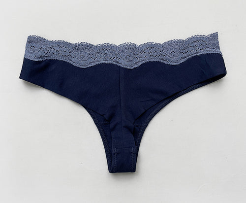 Flat lay back view displaying the minimal thong coverage and elegant lace waistband.