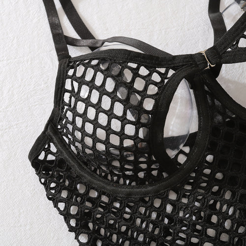 Close-up of the provocative open-bust strappy design and premium large-scale fishnet mesh texture on the bra top.