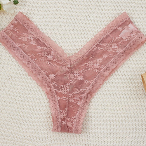 Flat lay view of pink delicate lace V-cut thong