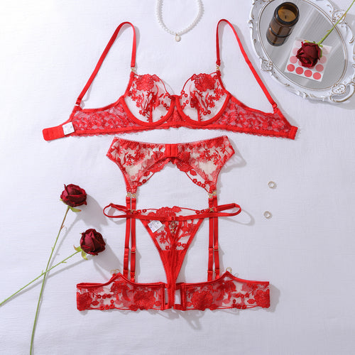 Flat lay presentation of the complete 3-piece KissKismet set, including the sweetheart bra, waist-cinching garter, and matching thong.
