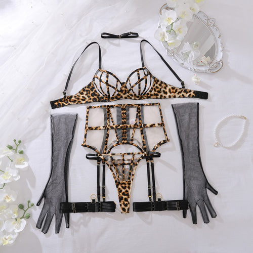 Full flat lay display of the 5-piece set including leopard bra, garter, thong, black choker, and sheer gloves.