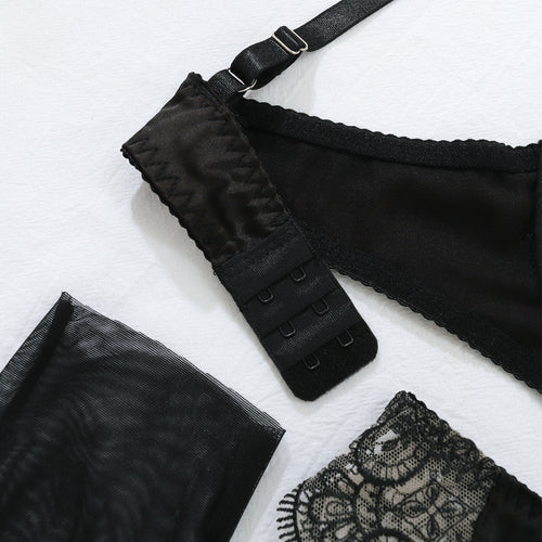 Detailed flat lay view of the multi-row hook-and-eye back closure on the KissKismet midnight muse balconette bra.