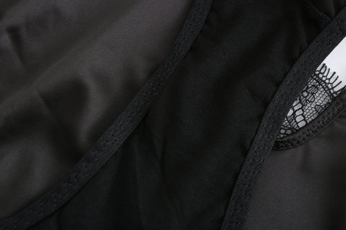 Close-up view of the inner lined gusset on the KissKismet black satin thong panty, highlighting the breathable comfort lining and secure overlock stitching.