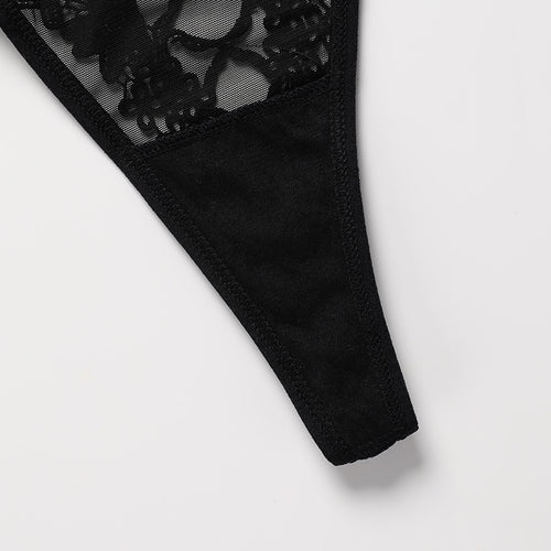 Close-up flat lay view of the soft cotton gusset and seamless edge finish on the KissKismet black sheer mesh panty.