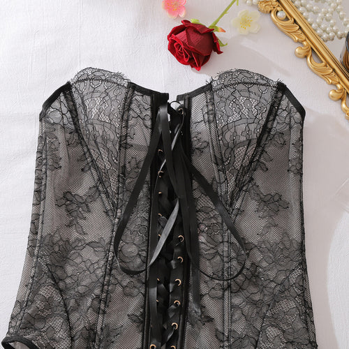 Detailed view of lace-up ribbon back on black sheer corset