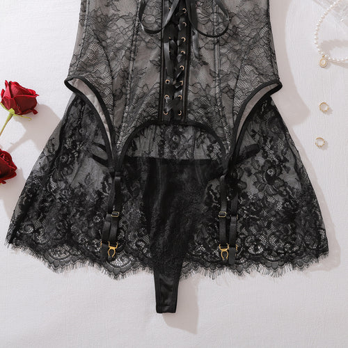 Intricate lace and strap detail of the black corset lingerie set
