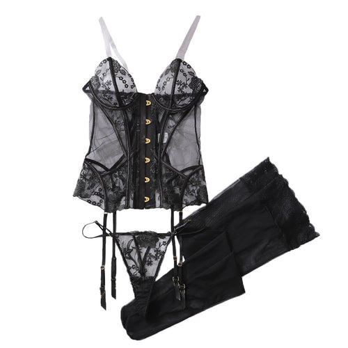 Full flat lay presentation of the KissKismet black lace corset, thong, and matching accessories.