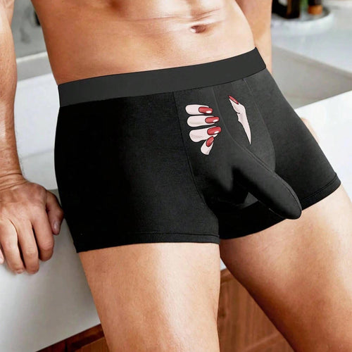 Front view of a man wearing KissKismet black novelty boxer briefs featuring a hilarious red-nail hand graphic and a roomy 3D pouch.