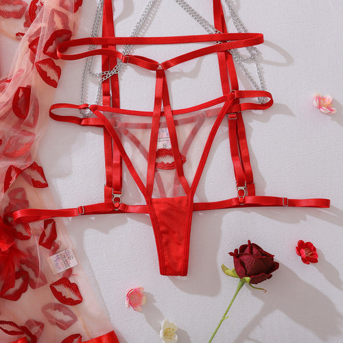 Detail of silver chain and garter hardware on red lingerie set