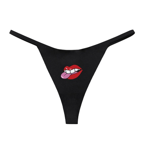 Flat lay presentation of the complete KissKismet lip print low-waisted seamless thong.