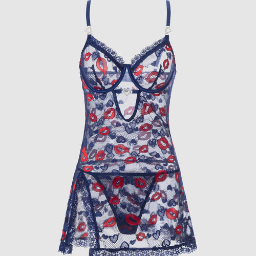 Full front flat lay display of the complete KissKismet Midnight Kiss lip print chemise and thong set.