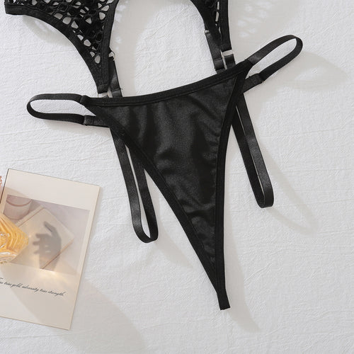 Flat lay close-up of the matching black strappy thong featuring double side elastic bands, part of the KissKismet fishnet 2-piece lingerie set.