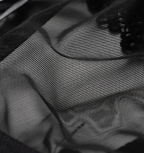 Detailed close-up of the ultra-soft, lightweight sheer black mesh fabric used in the KissKismet everyday seduction thong.