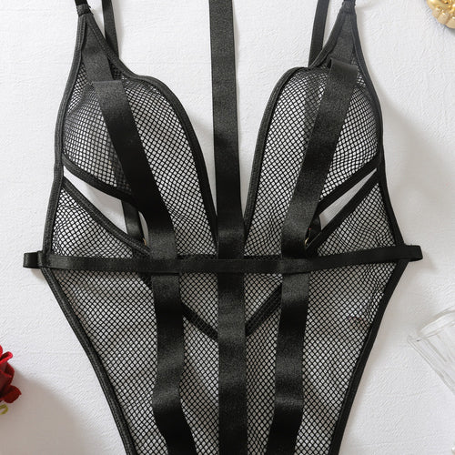 Close-up of fishnet texture and harness straps