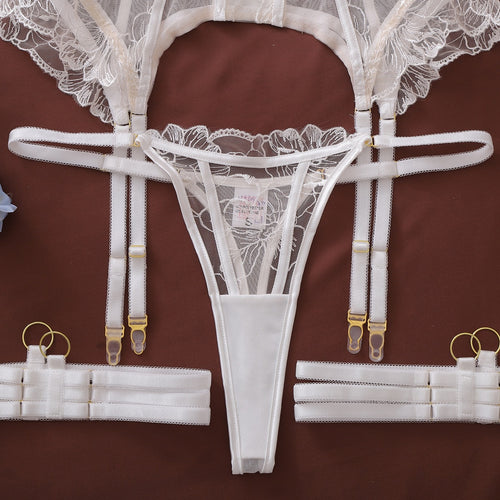 Flat lay of garter belt and thong components