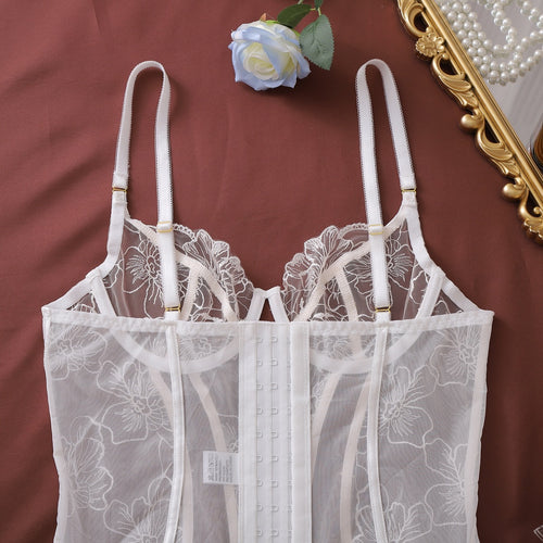 Close-up of white corset bustier stitching and lace