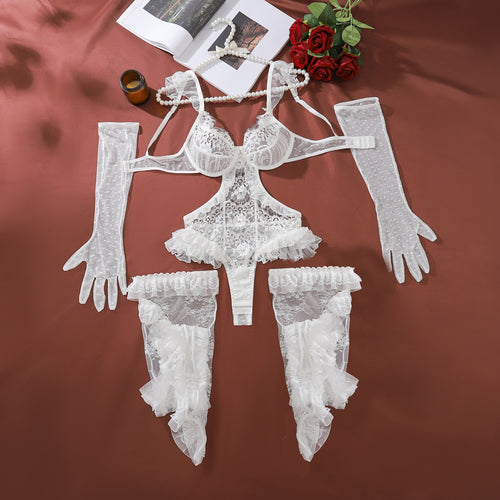 Flat lay of white 3-piece ruffled lace bodysuit set