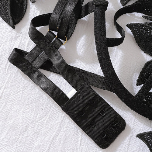 Detailed view of back hook and eye closure on bodysuit