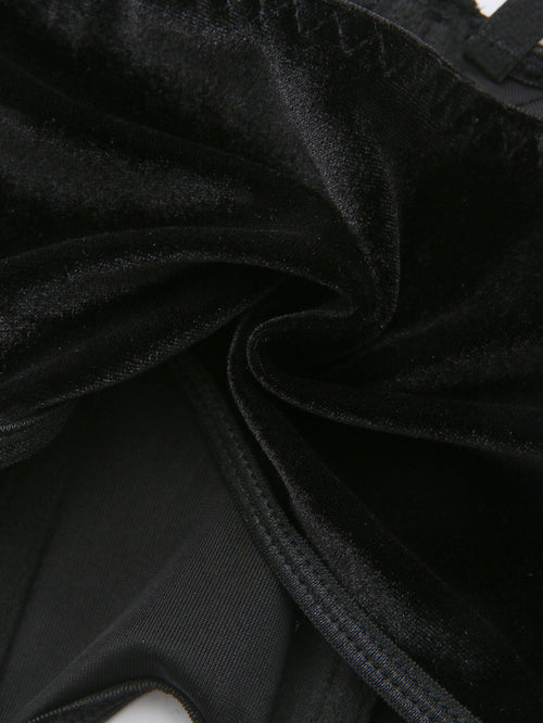 Close-up of the soft black velvet fabric texture and inner lining.