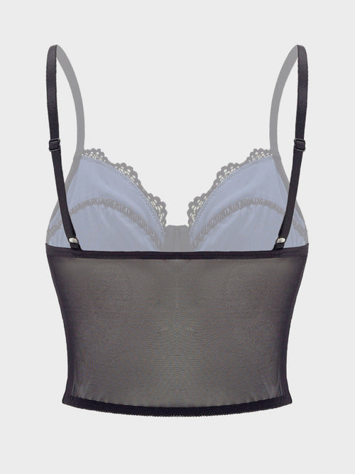 Flat lay back view of the structured midnight blue satin and black lace bustier camisole top, showcasing the lower mesh panel and converging strap design against a grey background.