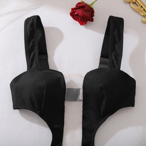 Detail of deep-plunge neckline on sculpting bodysuit